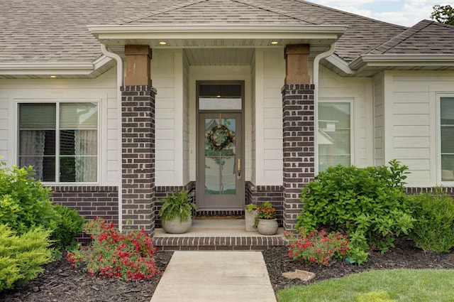 735 N Fox Hill Cir, Nixa, MO 65714 - property entrance featuring a shingled roof and brick siding