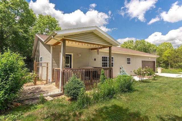 620 Dartmoore Dr, Rogersville, MO 65742 - back of house with an attached garage, a lawn, concrete driveway, and a wooden deck