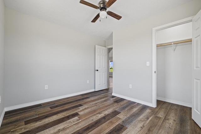 1079 Wiseman Rd, Marshfield, MO 65706 - unfurnished bedroom featuring dark wood finished floors, a closet, baseboards, and a ceiling fan