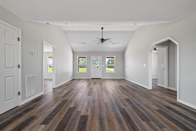 1079 Wiseman Rd, Marshfield, MO 65706 - unfurnished living room with ceiling fan, lofted ceiling, dark wood-style flooring, baseboards, and arched walkways