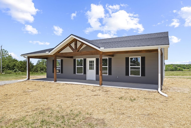 1079 Wiseman Rd, Marshfield, MO 65706 - view of front of house featuring a patio and roof with shingles