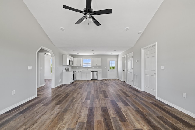 1079 Wiseman Rd, Marshfield, MO 65706 - unfurnished living room featuring ceiling fan, dark wood-type flooring, baseboards, and lofted ceiling