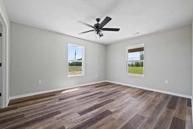 1079 Wiseman Rd, Marshfield, MO 65706 - empty room featuring dark wood-type flooring, ceiling fan, and baseboards