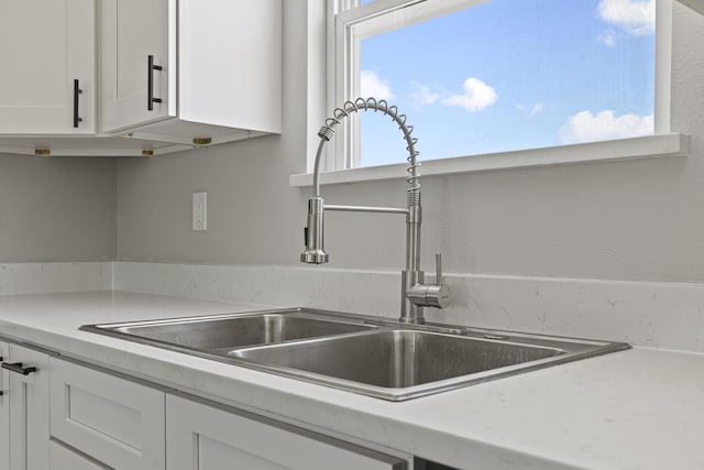 1079 Wiseman Rd, Marshfield, MO 65706 - kitchen view of a sink and white cabinets