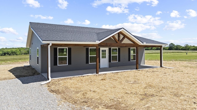 1079 Wiseman Rd, Marshfield, MO 65706 - view of front of property featuring a shingled roof and a patio area