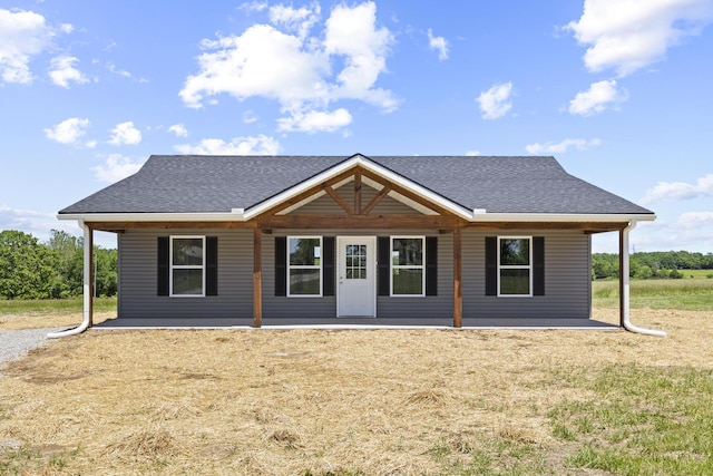 1079 Wiseman Rd, Marshfield, MO 65706 - rear view of property with a shingled roof, a yard, and a patio area