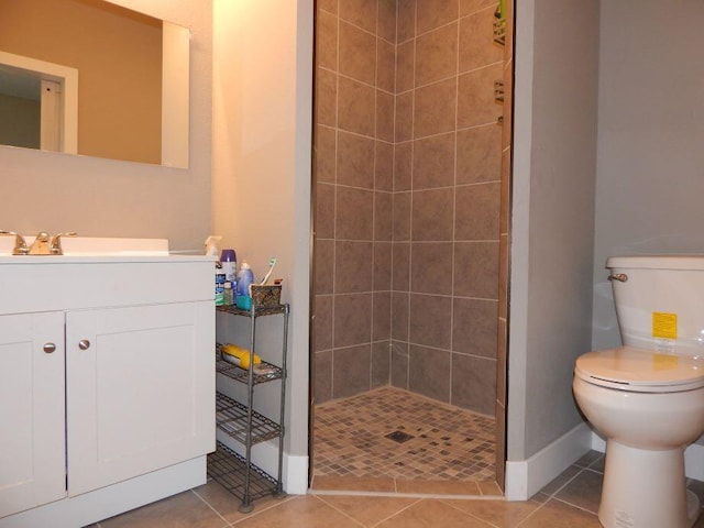 510 Kenny St, Ava, MO 65608 - bathroom with toilet, tiled shower, vanity, baseboards, and tile patterned flooring