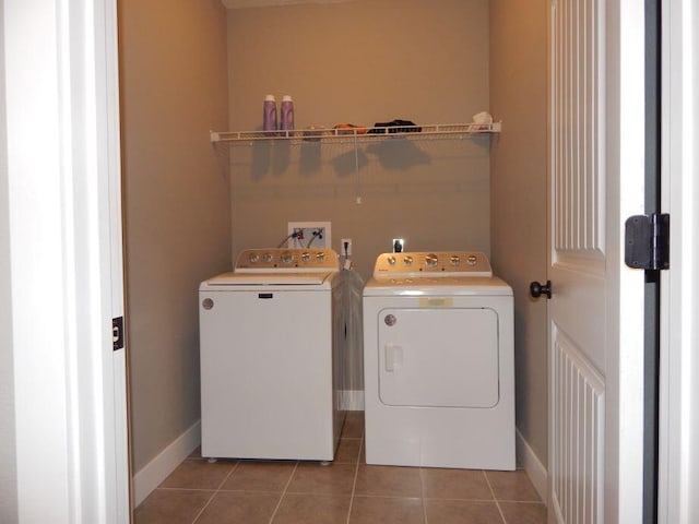 510 Kenny St, Ava, MO 65608 - laundry area featuring washing machine and dryer, tile patterned flooring, and baseboards