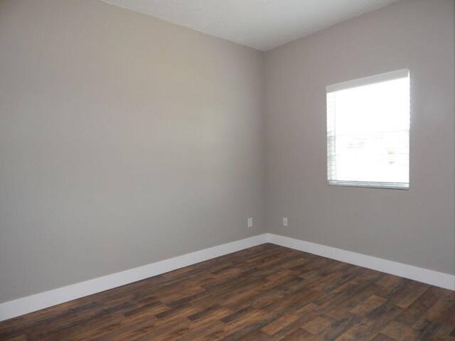 510 Kenny St, Ava, MO 65608 - unfurnished room with baseboards and dark wood finished floors