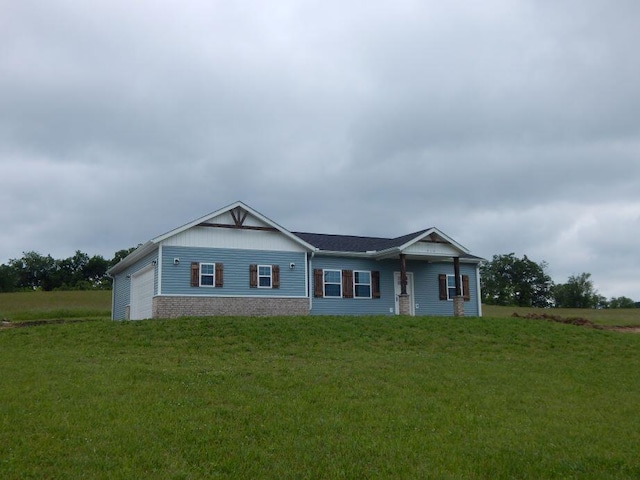 510 Kenny St, Ava, MO 65608 - view of front facade with a front yard and an attached garage