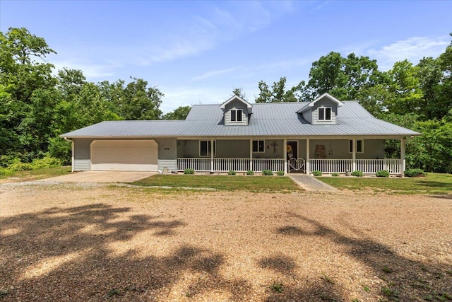 657 Plentywood Ln, Gainesville, MO 65655 - farmhouse inspired home featuring a porch, dirt driveway, a garage, and metal roof