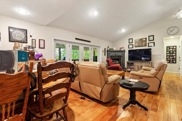 657 Plentywood Ln, Gainesville, MO 65655 - living area featuring lofted ceiling, light wood-style floors, french doors, a fireplace, and recessed lighting