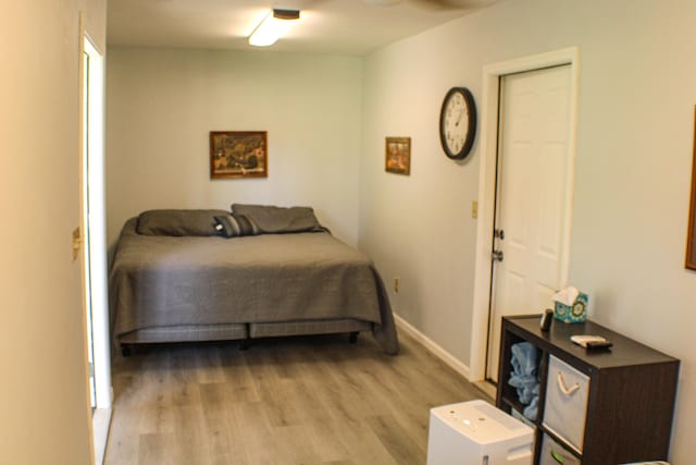 821 NW B Hwy, Osceola, MO 64776 - bedroom with light wood-type flooring and baseboards