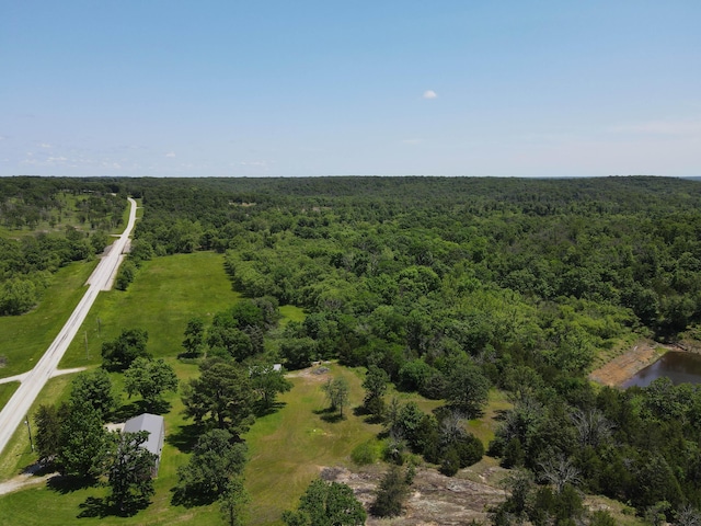 821 NW B Hwy, Osceola, MO 64776 - aerial view of property and surrounding area with a heavily wooded area and a large body of water