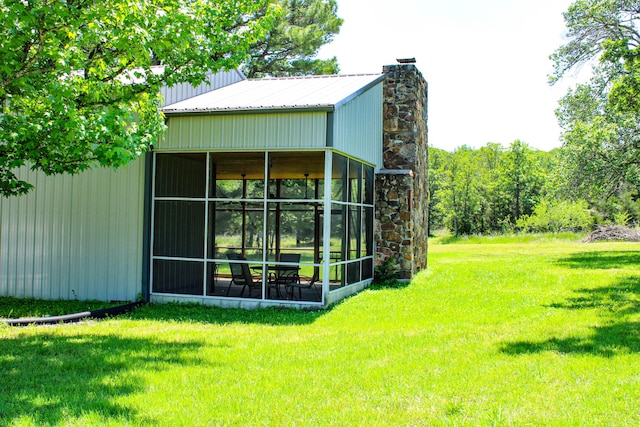 821 NW B Hwy, Osceola, MO 64776 - view of side of property featuring a chimney and a lawn