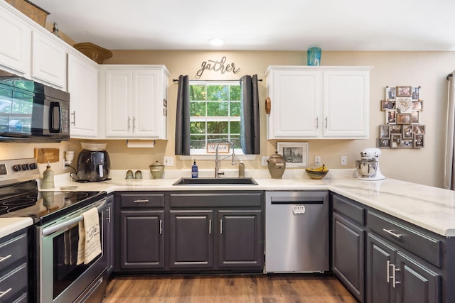 485 Eagle Dr, Forsyth, MO 65653 - kitchen with appliances with stainless steel finishes, a sink, white cabinets, light countertops, and recessed lighting