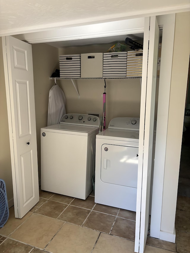 2510 W Madison St, Springfield, MO 65802 - washroom featuring washing machine and dryer and tile patterned flooring
