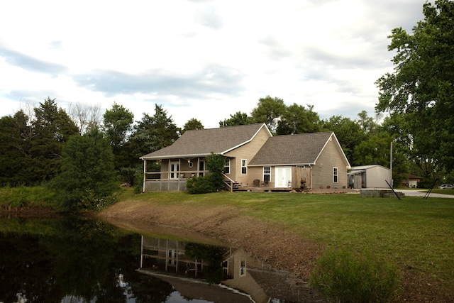 411 N Main St, Diamond, MO 64840 - back of house featuring a lawn and a water view