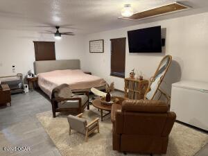 411 N Main St, Diamond, MO 64840 - bedroom featuring attic access