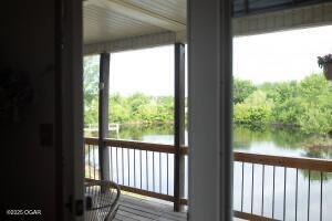 411 N Main St, Diamond, MO 64840 - entryway with a water view and plenty of natural light