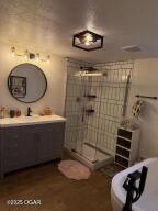 411 N Main St, Diamond, MO 64840 - bathroom with vanity and a stall shower
