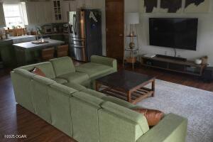 411 N Main St, Diamond, MO 64840 - living area with wood finished floors