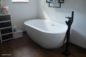 411 N Main St, Diamond, MO 64840 - bathroom featuring a freestanding bath