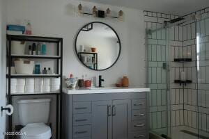 411 N Main St, Diamond, MO 64840 - full bath with vanity, toilet, and a shower with door