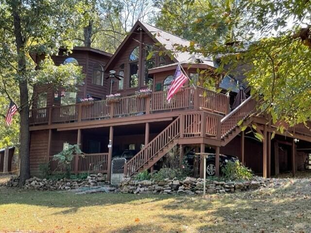2382 Minnow Dr, Omaha, AR 72662 - back of property featuring a deck, stairs, and a lawn