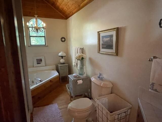 2382 Minnow Dr, Omaha, AR 72662 - bathroom with wood ceiling, a jetted tub, toilet, a chandelier, and lofted ceiling