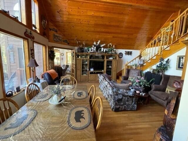 2382 Minnow Dr, Omaha, AR 72662 - dining room with wood finished floors, wood ceiling, stairs, and high vaulted ceiling