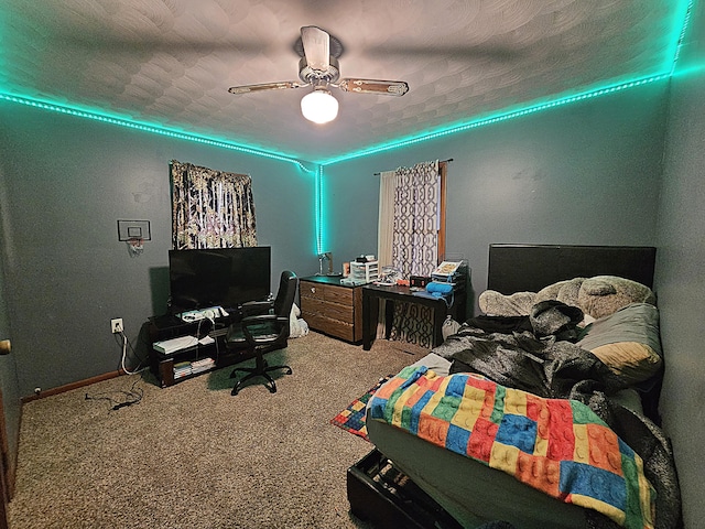 22182 County Road 288, Pittsburg, MO 65724 - carpeted bedroom with a desk, ceiling fan, and baseboards