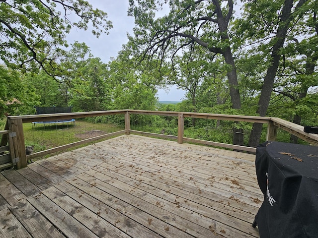 22182 County Road 288, Pittsburg, MO 65724 - wooden terrace featuring a trampoline and a grill