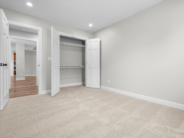8863 Serene Acres Ln, Rogersville, MO 65742 - unfurnished bedroom with light carpet, baseboards, a closet, and recessed lighting