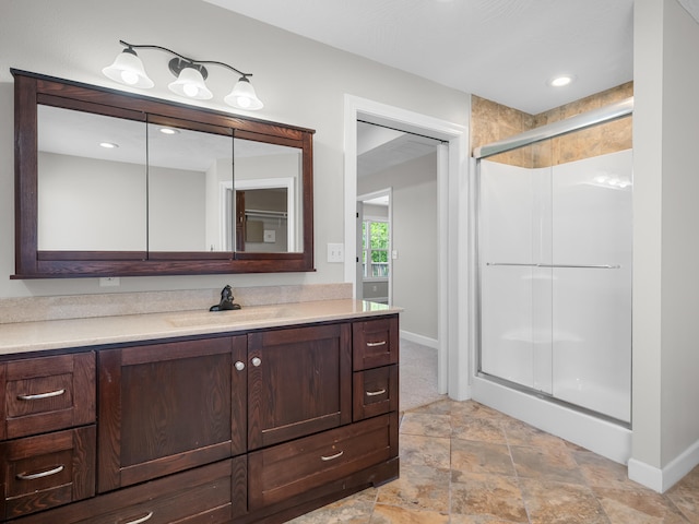 8863 Serene Acres Ln, Rogersville, MO 65742 - bathroom featuring baseboards, vanity, a stall shower, stone finish floors, and recessed lighting