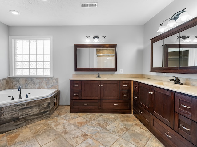 8863 Serene Acres Ln, Rogersville, MO 65742 - bathroom with double vanity, a garden tub, and stone finish floors