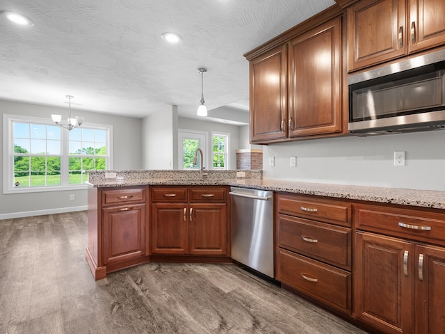 8863 Serene Acres Ln, Rogersville, MO 65742 - kitchen with appliances with stainless steel finishes, a sink, dark wood-style flooring, healthy amount of natural light, and recessed lighting