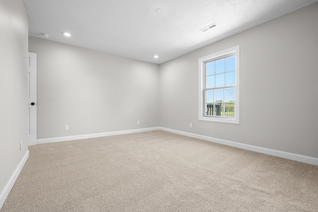 8863 Serene Acres Ln, Rogersville, MO 65742 - spare room featuring light carpet, baseboards, recessed lighting, and a smoke detector