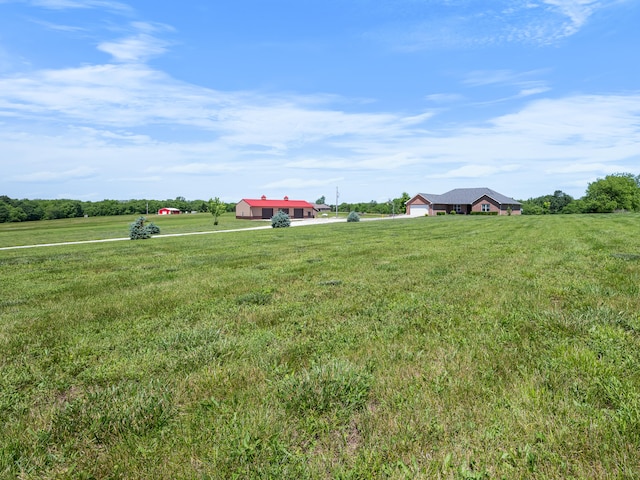 8863 Serene Acres Ln, Rogersville, MO 65742 - view of green lawn featuring a view of rural / pastoral area