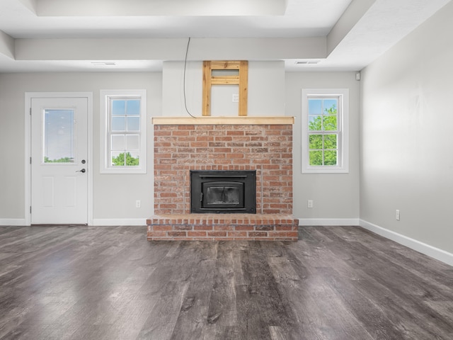 8863 Serene Acres Ln, Rogersville, MO 65742 - unfurnished living room with baseboards, wood finished floors, a brick fireplace, and a raised ceiling