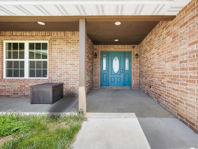 8863 Serene Acres Ln, Rogersville, MO 65742 - doorway to property featuring brick siding and a porch