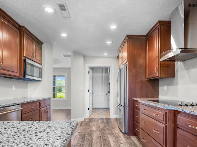 8863 Serene Acres Ln, Rogersville, MO 65742 - kitchen featuring wall chimney range hood, stainless steel appliances, light wood-style floors, recessed lighting, and baseboards