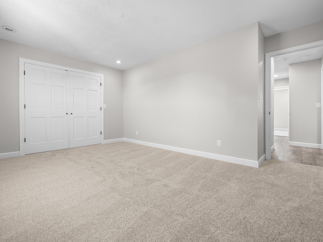 8863 Serene Acres Ln, Rogersville, MO 65742 - unfurnished bedroom featuring carpet flooring, baseboards, a closet, and recessed lighting