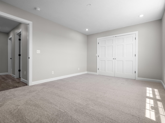8863 Serene Acres Ln, Rogersville, MO 65742 - unfurnished bedroom featuring carpet, baseboards, a closet, and recessed lighting