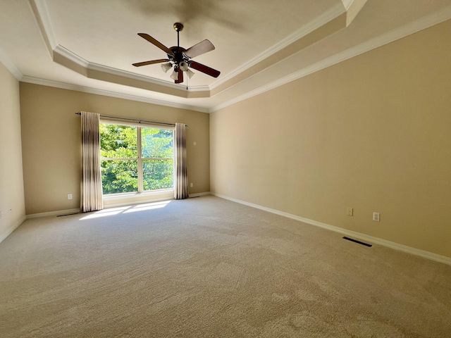 1207 Ledgestone Cir, Branson West, MO 65737 - carpeted spare room with a tray ceiling, crown molding, a ceiling fan, and baseboards