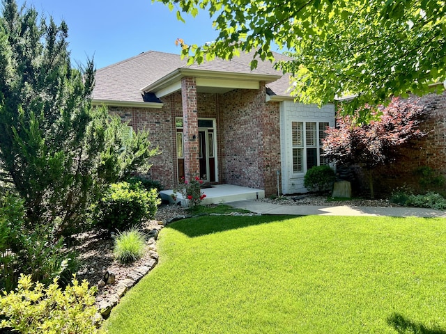 1207 Ledgestone Cir, Branson West, MO 65737 - view of front of property with a front yard, roof with shingles, and brick siding