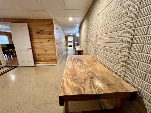 1207 Ledgestone Cir, Branson West, MO 65737 - hallway featuring wood walls, a drop ceiling, recessed lighting, and baseboards