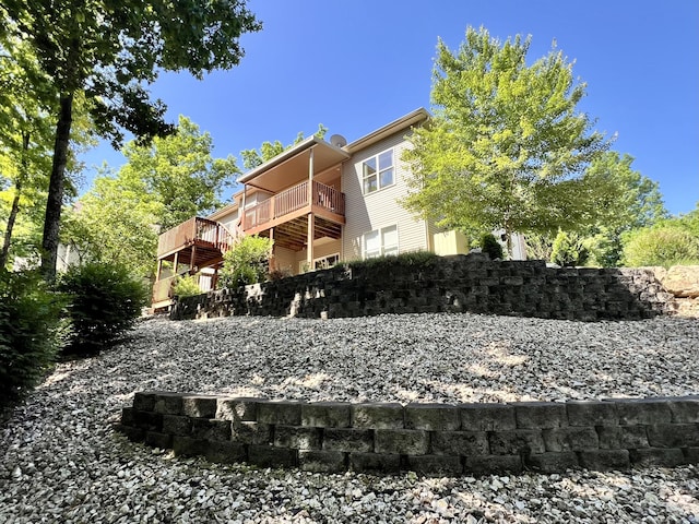1207 Ledgestone Cir, Branson West, MO 65737 - back of property with a deck