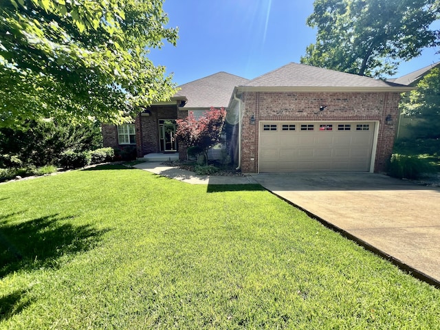 1207 Ledgestone Cir, Branson West, MO 65737 - ranch-style house featuring brick siding, an attached garage, driveway, and a front lawn