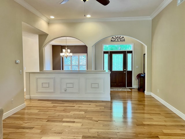 1207 Ledgestone Cir, Branson West, MO 65737 - entryway with a ceiling fan, light wood-type flooring, crown molding, a chandelier, and arched walkways